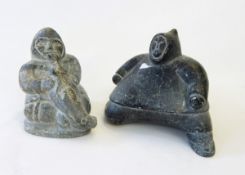 Two Canadian inuit-style hardstone figures, one of a seated figure with seal,