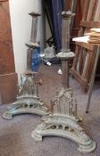 A large pair of ecclesiastical metal candlesticks in the Gothic revival style,