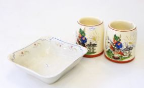 Two pottery mugs by Rudolf Wachter with comical alpine scenes and a dish