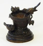 A bronze table centrepiece modelled as a flowerpot,