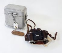 German Compur- Verschluss camera in leather carrying case and a German aluminum mess tin (2)