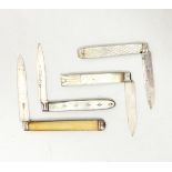 A collection of silver fruit knives,
