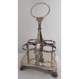 George IV silver four bottle condiment stand raised on palmette feet, London 1828,