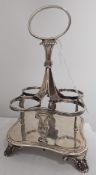 George IV silver four bottle condiment stand raised on palmette feet, London 1828,