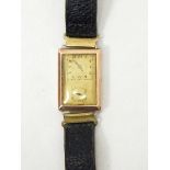 A gent's 9ct gold wristwatch of rectangular form with leather strap Live Bidding: