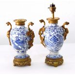 Pair Chinese porcelain ovoid footed armorial vases with ormolu mounts,