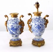 Pair Chinese porcelain ovoid footed armorial vases with ormolu mounts,