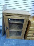 An old pine dwarf cupboard enclosed by glass panelled door,