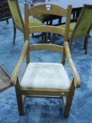 A set of six French oak framed craft made ladderback style dining chairs comprising two carver