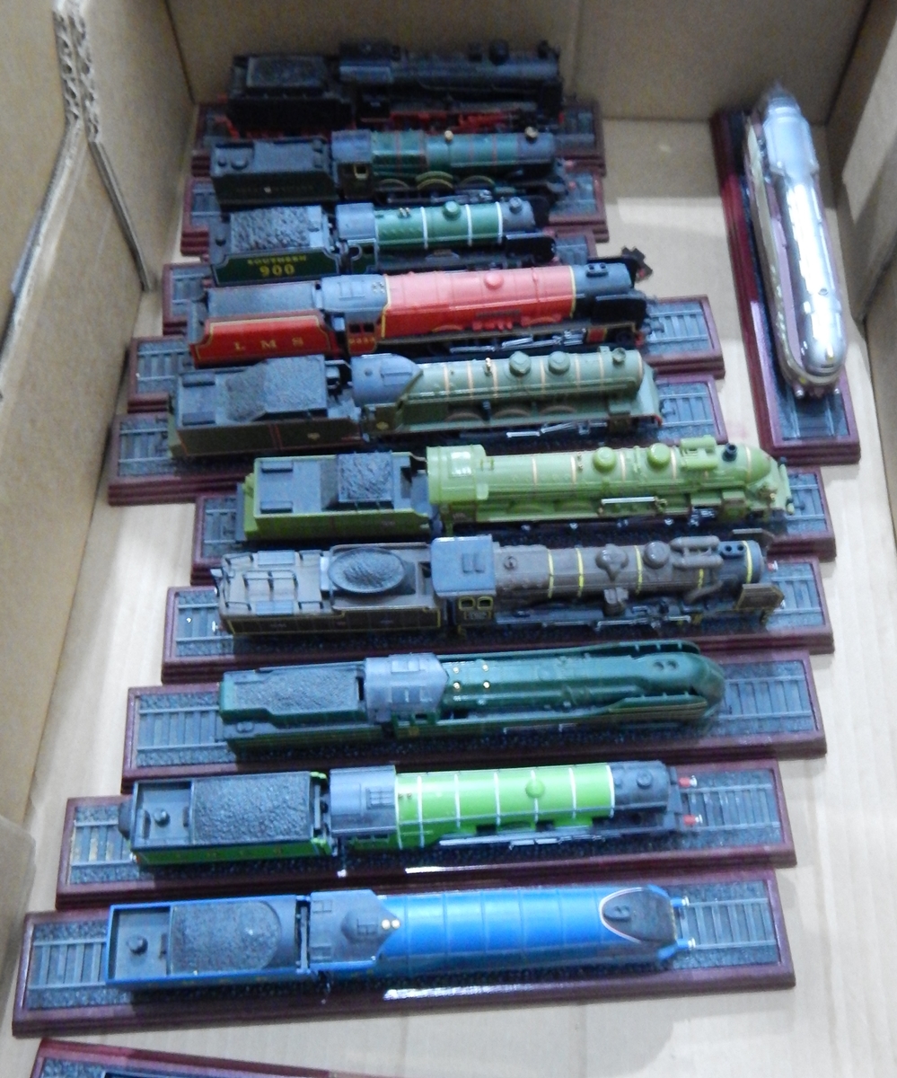 A quantity of painted plastic models of locomotives,