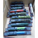 A quantity of painted plastic models of locomotives,