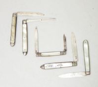 A collection of Georgian and later silver fruit knives with mother-of-pearl handles and a folding