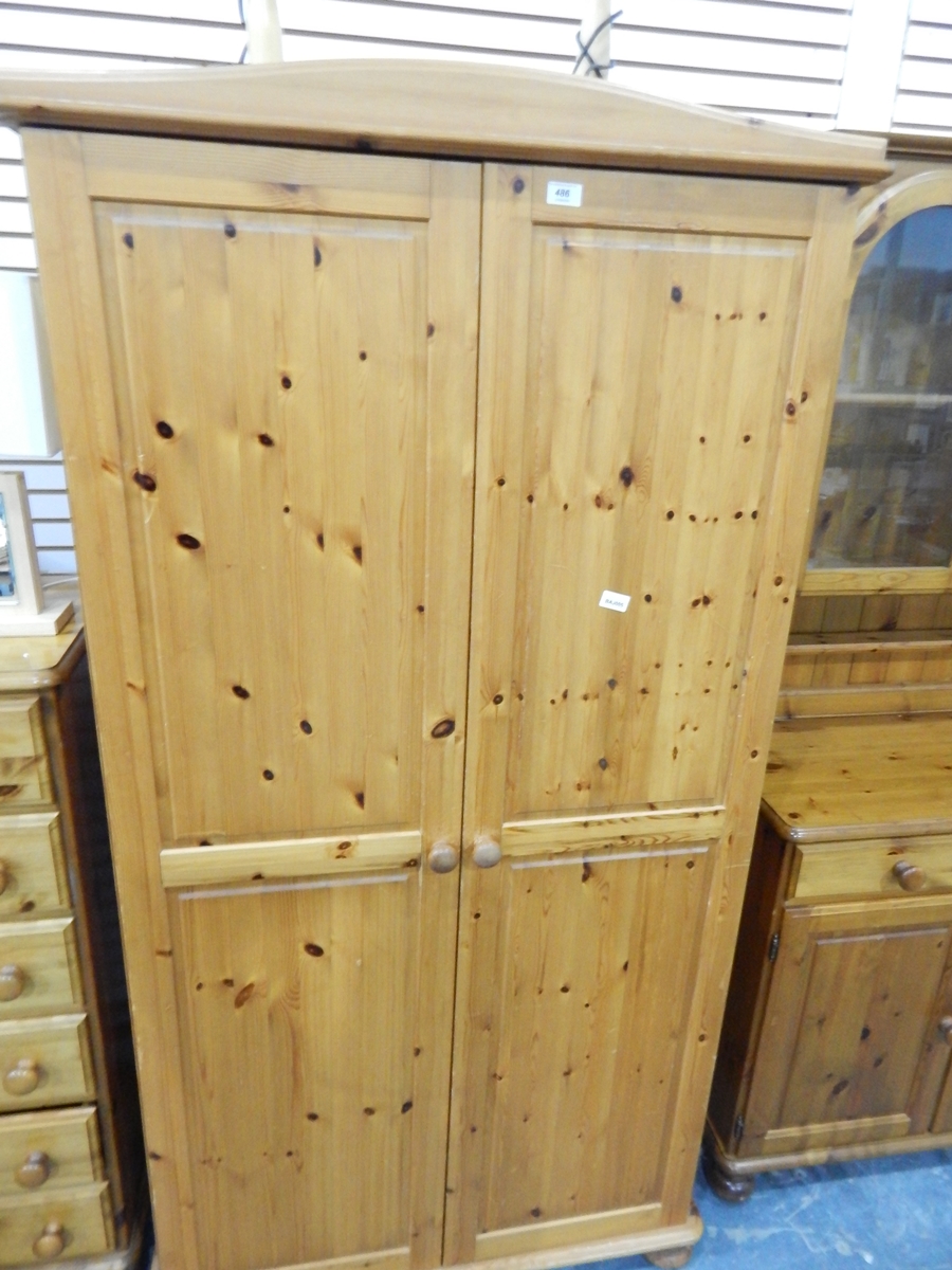 A pine two-door wardrobe,