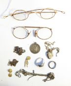 Pair of old gold-coloured metal rimmed spectacles, another pair,