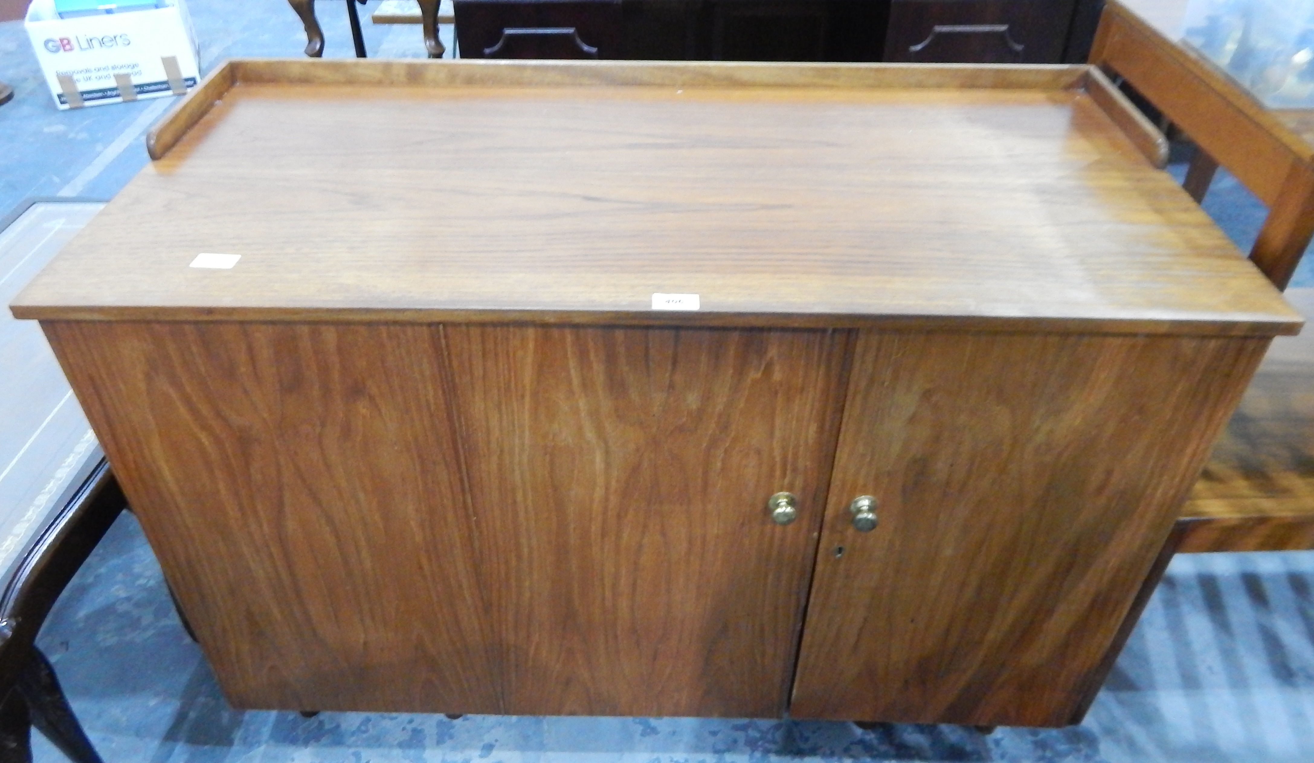 An oak dressing table opening to reveal fitted interior,