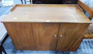 An oak dressing table opening to reveal fitted interior,