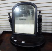 A Victorian mahogany swing framed toilet mirror with shaped plinth base,