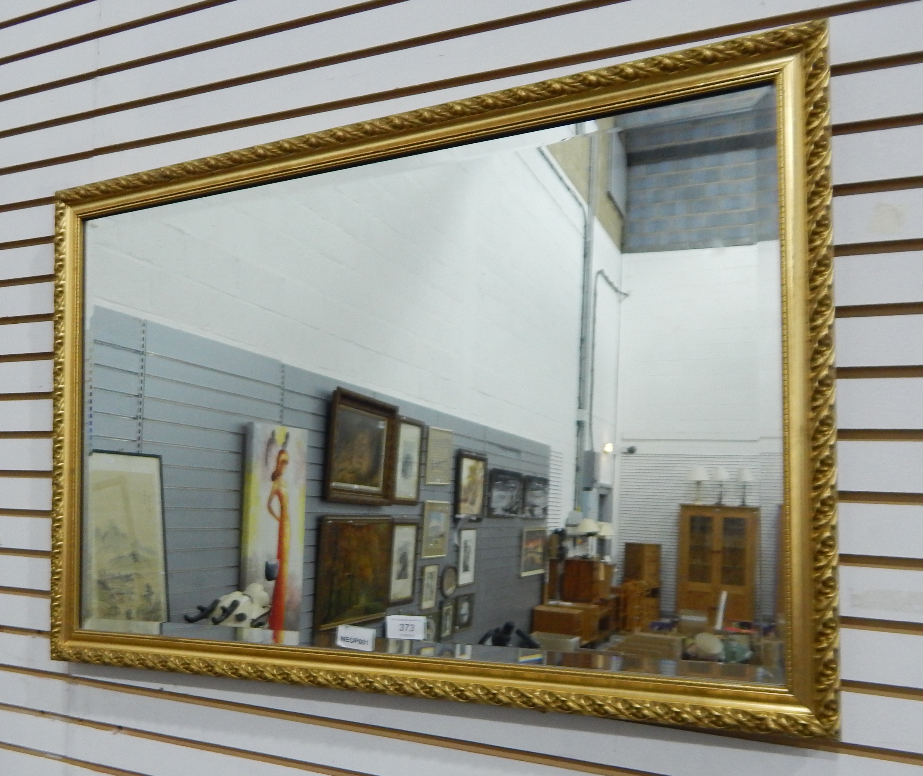 A rectangular bevelled plate wall mirror within a gilt moulded frame - Image 2 of 2