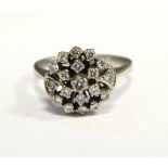 White metal and diamond cluster ring set numerous tiny stones