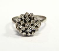 White metal and diamond cluster ring set numerous tiny stones