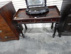 A Victorian mahogany washstand having three-quarter gallery over two frieze drawers and on turned