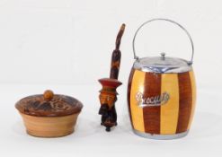 A quantity of decorative wood ware including biscuit barrels, pipe rack, smoker's cabinet, etc.