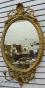 A Georgian style giltwood girandole mirror with carved foliate decoration,