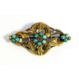 Victorian gold-coloured metal turquoise and garnet set brooch of openwork foliate scroll pattern