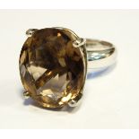 Large silver and Sri Lankan topaz ring set oval smoky facet-cut stone