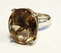 Large silver and Sri Lankan topaz ring set oval smoky facet-cut stone