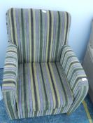An easy chair upholstered in a striped velvet type fabric