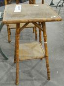 A two-tier bamboo framed table