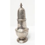 A silver sugar castor of baluster form with pierced cover,