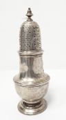 A silver sugar castor of baluster form with pierced cover,