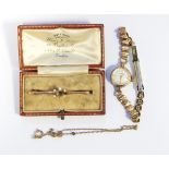 Lady's Roamer rolled gold wristwatch with baton numerals and a 9ct gold and seedpearl bar brooch