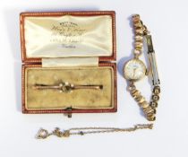 Lady's Roamer rolled gold wristwatch with baton numerals and a 9ct gold and seedpearl bar brooch