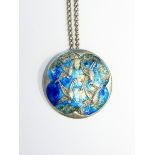 Arts & Crafts silver and enamel pendant, circular, embossed with birds in flight,