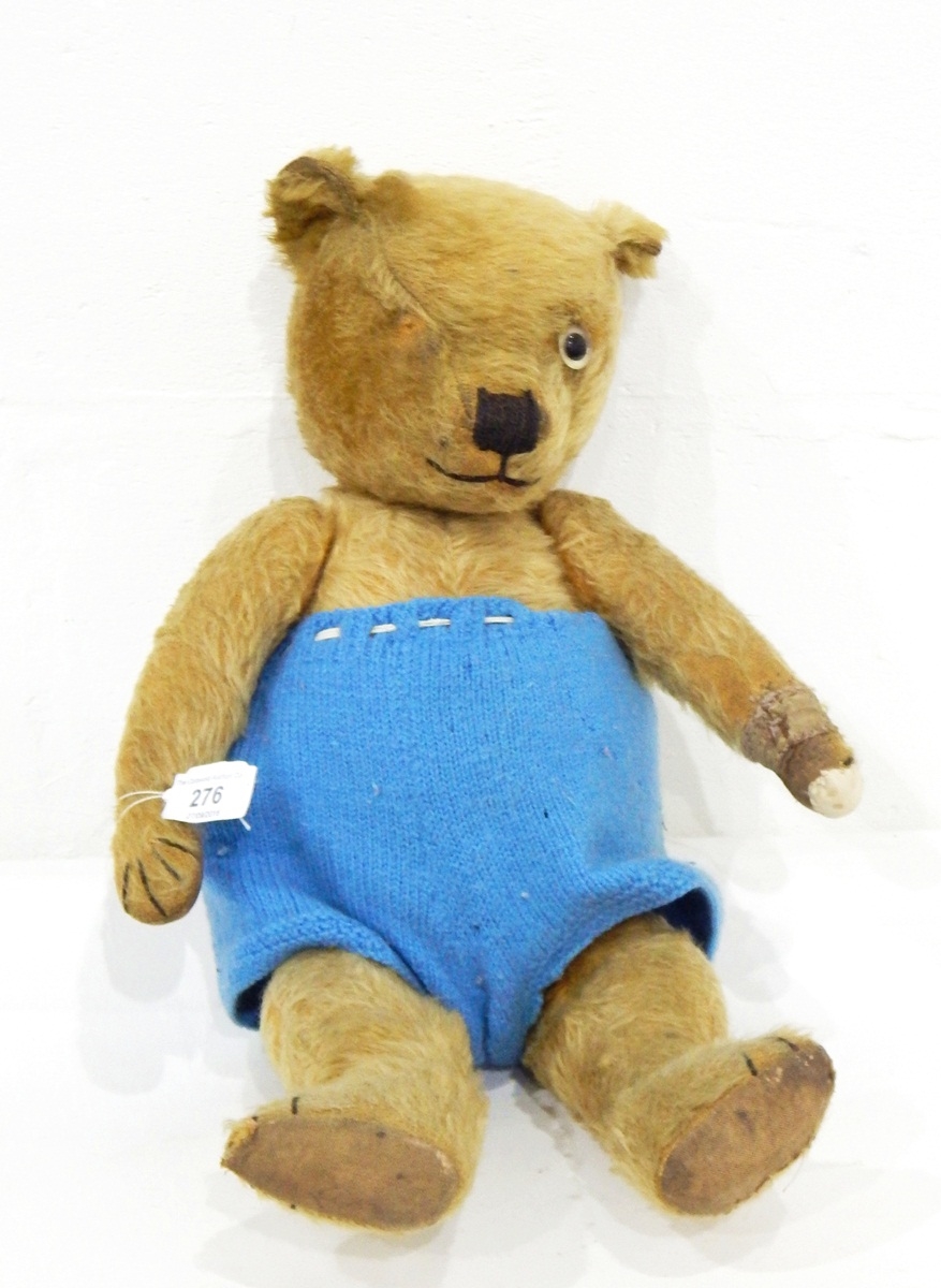 A vintage gold plush teddy bear with stitched snout (one eye missing)