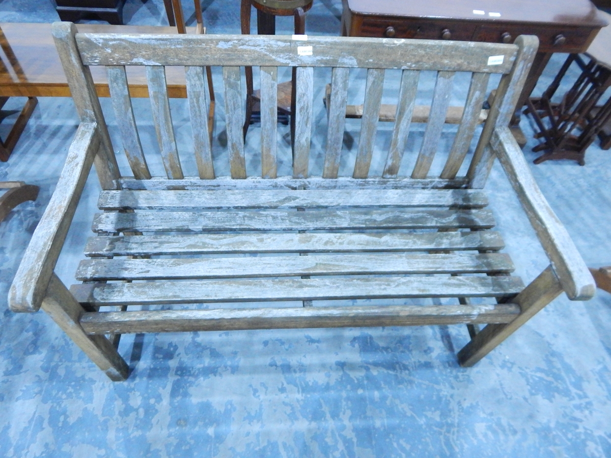 A slat back and seated garden bench seat
