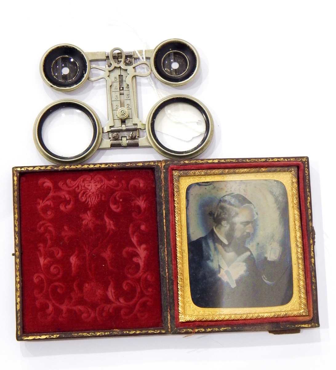 Two Victorian daguerreotypes, cased and a metal folding viewer in leather case by R & J F Limited,