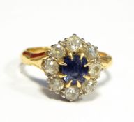 18ct sapphire and diamond cluster ring set centre sapphire and surround of eight diamonds