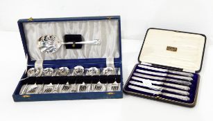A set of silver teaspoons and nips,
