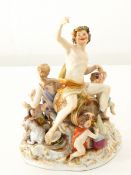 A pair of Meissen figure ornaments of a gentleman with lamb and his lady with tambourine (damaged),