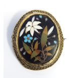 Victorian gold-coloured metal and pietra dura hardstone brooch, oval, decorated with floral spray,