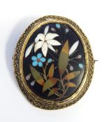 Victorian gold-coloured metal and pietra dura hardstone brooch, oval, decorated with floral spray,
