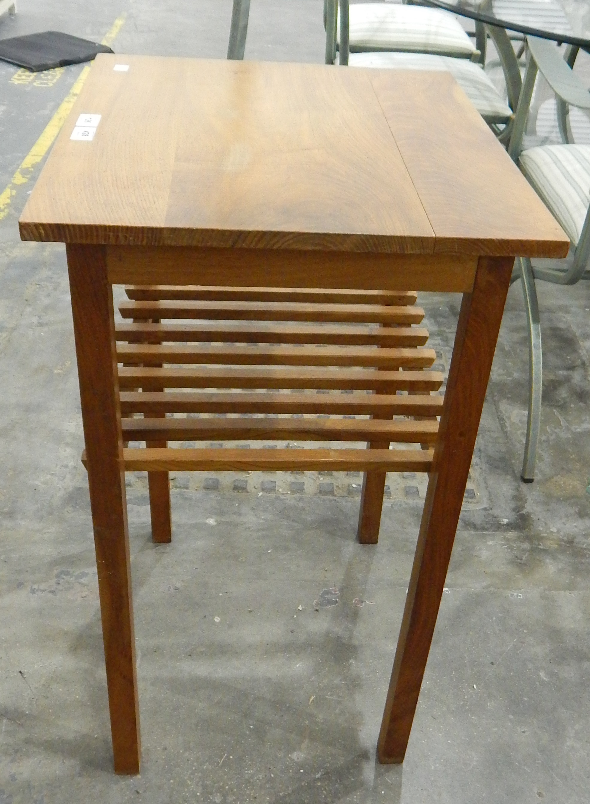 A walnut rectangular top side table, with open rack shelf below, on square legs,