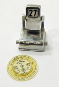 A chrome perpetual desk calendar together with a Negretti & Zambra forecaster