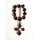 Victorian garnet brooch set ten circular facet cut stones and having garnet and pearl pendant