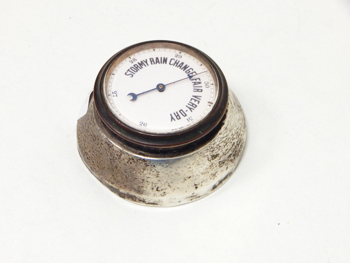 A desk barometer with enamel dial and silver mounts