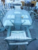 A painted metal and glass dining table and set of six chairs